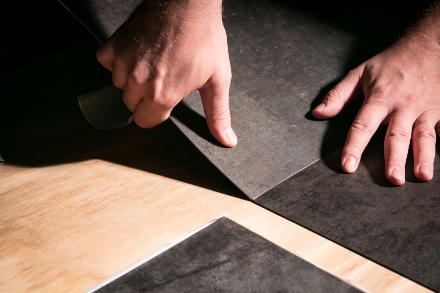 Hand installation of vinyl flooring tiles. 5 Benefits Of Vinyl Plank Flooring